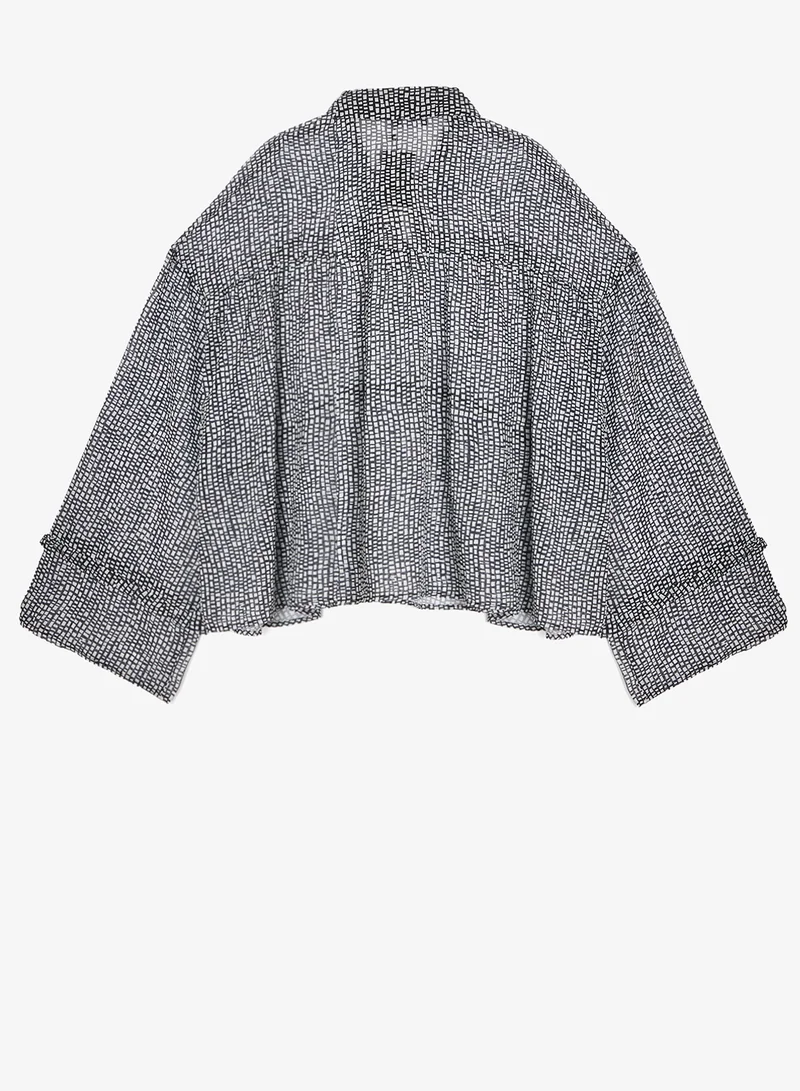 جينجر بلس بلوزة بأزرار وطبعة أحادية اللون